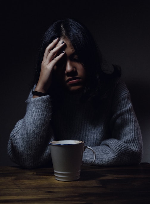 depressed person over coffee