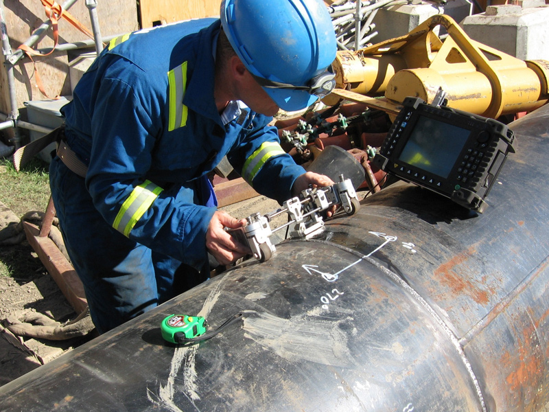 A man checking the quality of the pipe and piping system