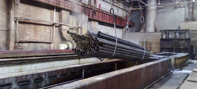 pipe going into a metal pickling vat