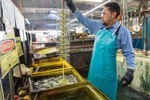 man performing electroplating