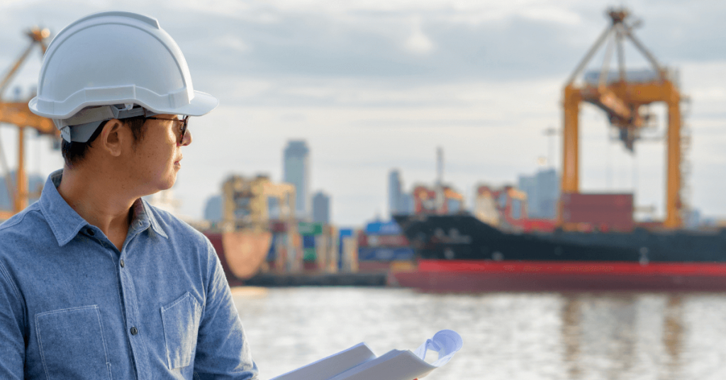 Man standing by structural with hardhat