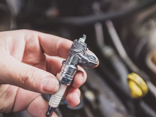 An anti-seize lubricant on a spark plug.