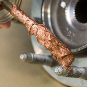 Too much amount of anti-seize lubricant to put on spark plug.