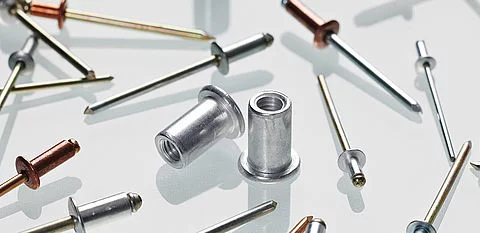 Different types of rivets and materials on the floor